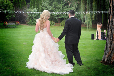 Bride and groom holding hands