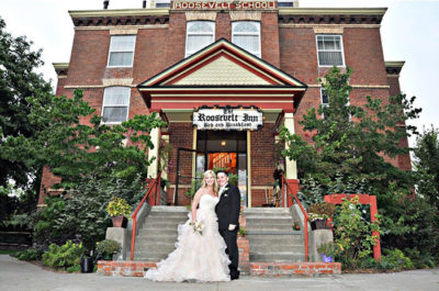 Bride and groom in front of The Roosevelt Inn